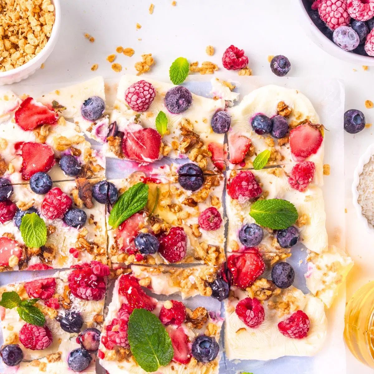 Vegan frozen yogurt bark cut into pieces