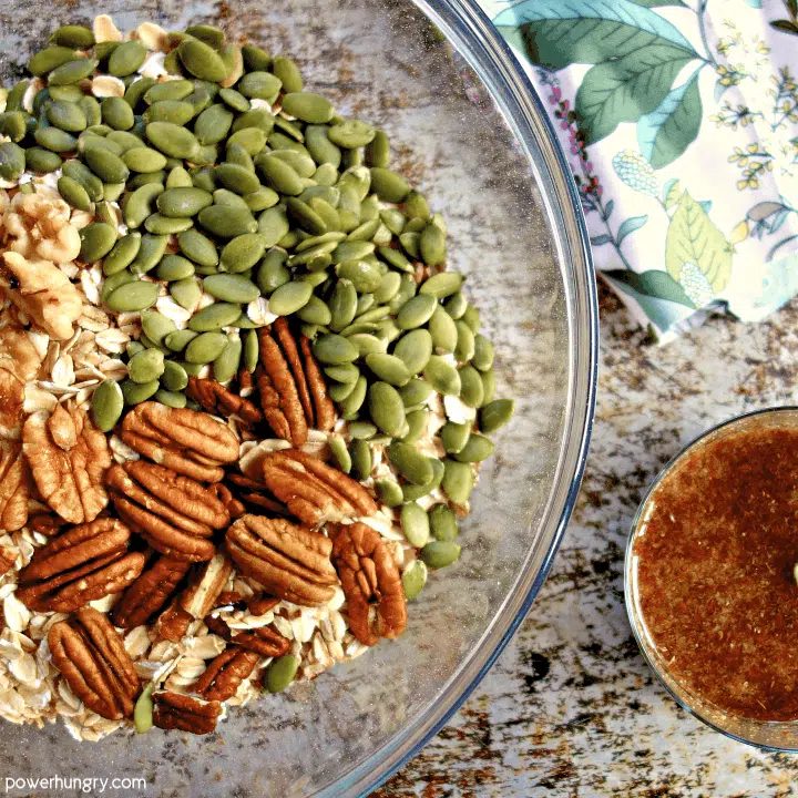 dry ingredients and wet ingredients for oil free granola in separate bowls