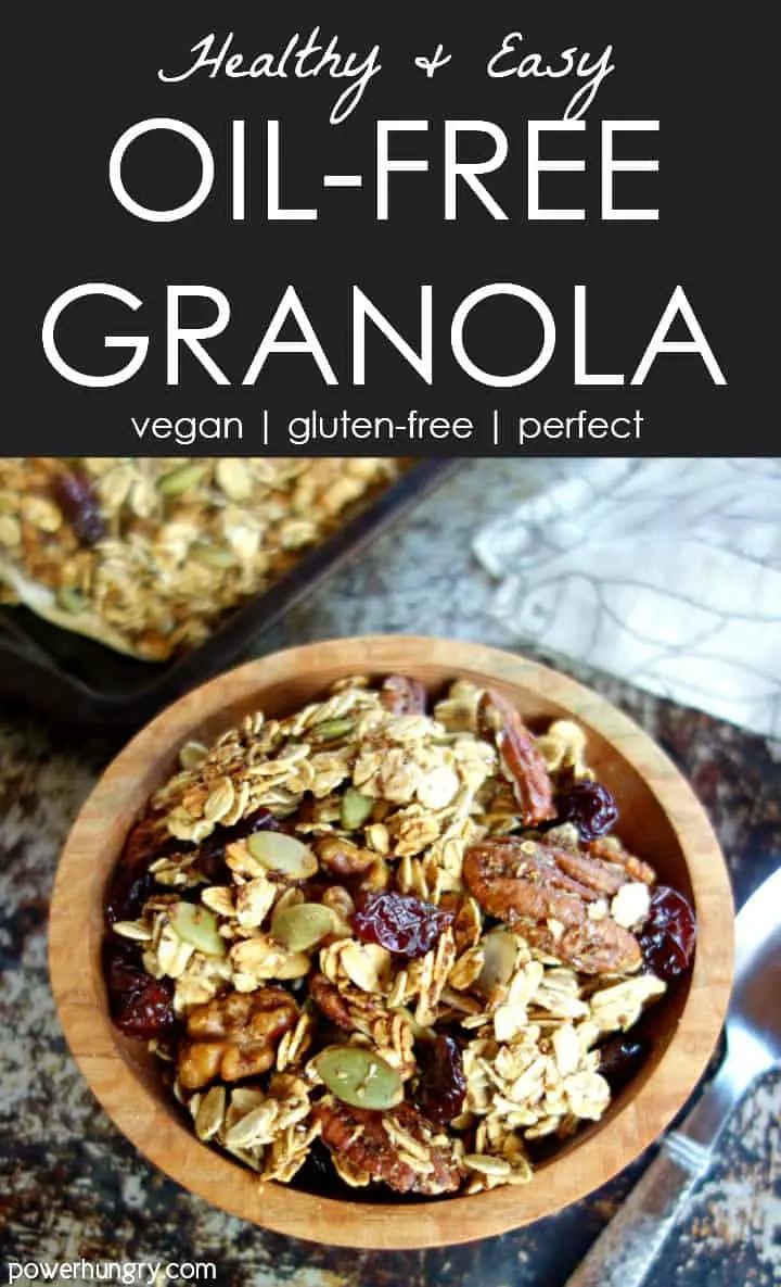 nourishing oil-free granola in a wooden bowl with sheet pan of granola and napkin in background