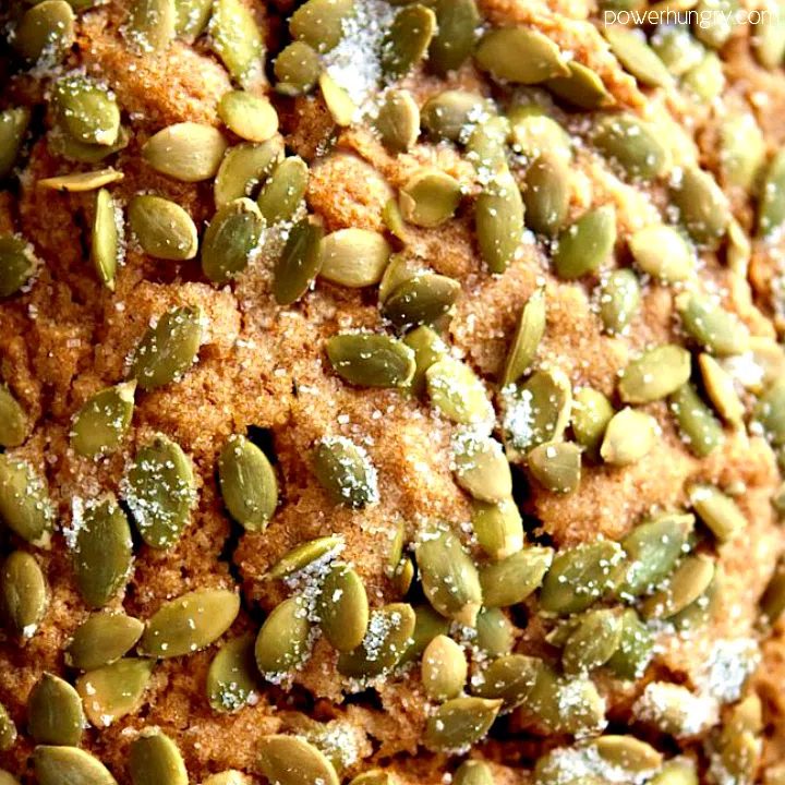 close up of the top of vegan pumpkin bread madewith gluten-free flour and topped with pepitas