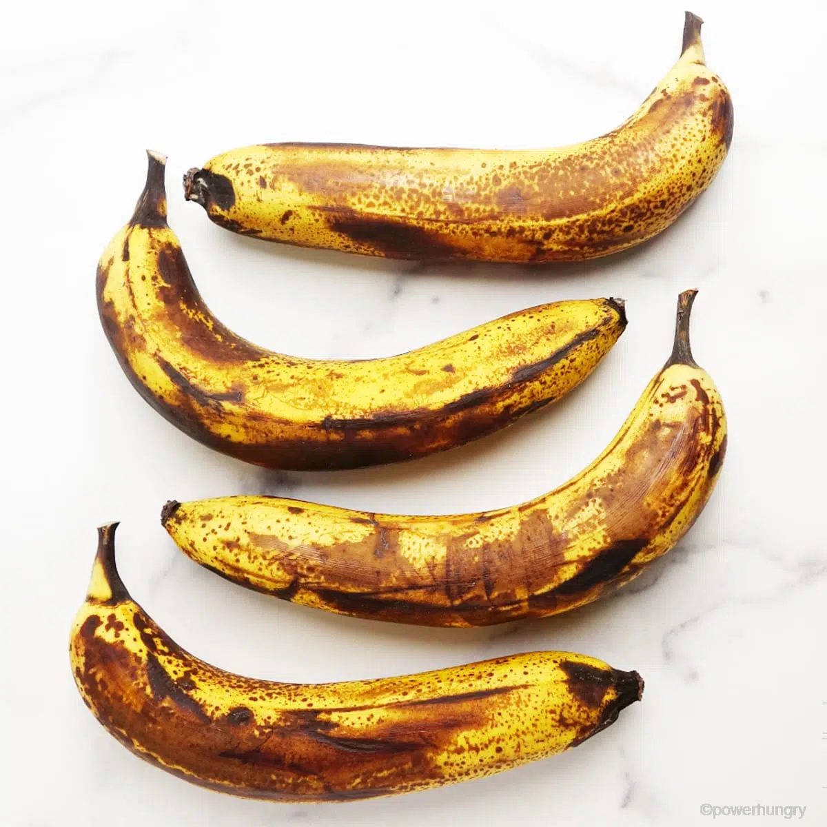 overead shot of 4 very ripe bananas