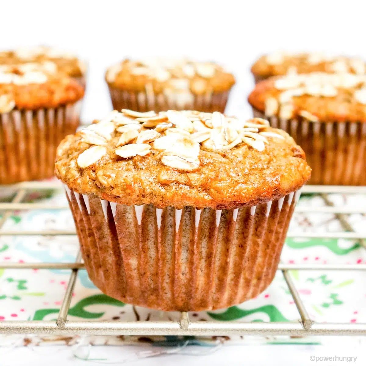banana oat muffin that is vegan and gluten-free on a cooling rack