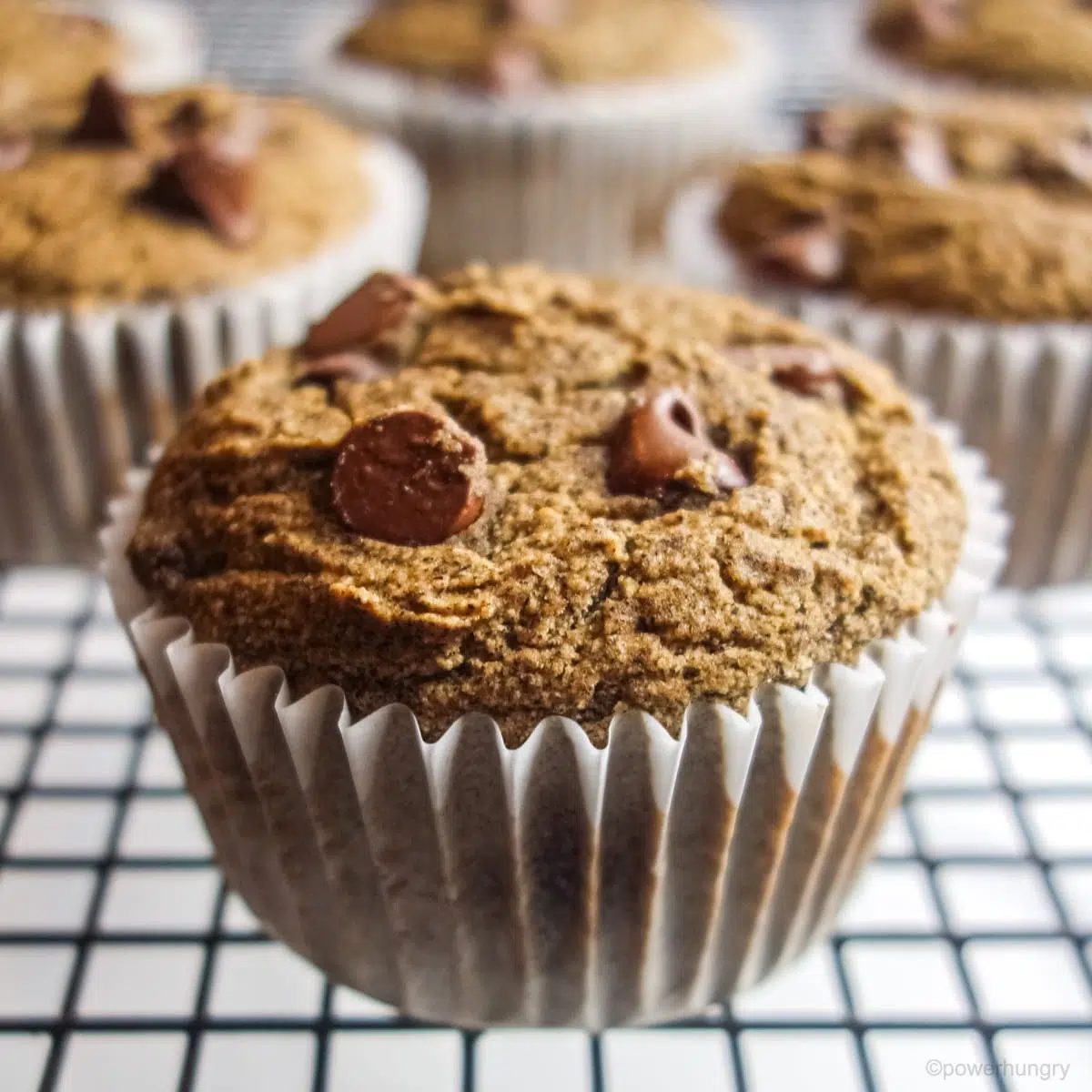 close up of a buckwheat flour muffin on a cooling rack