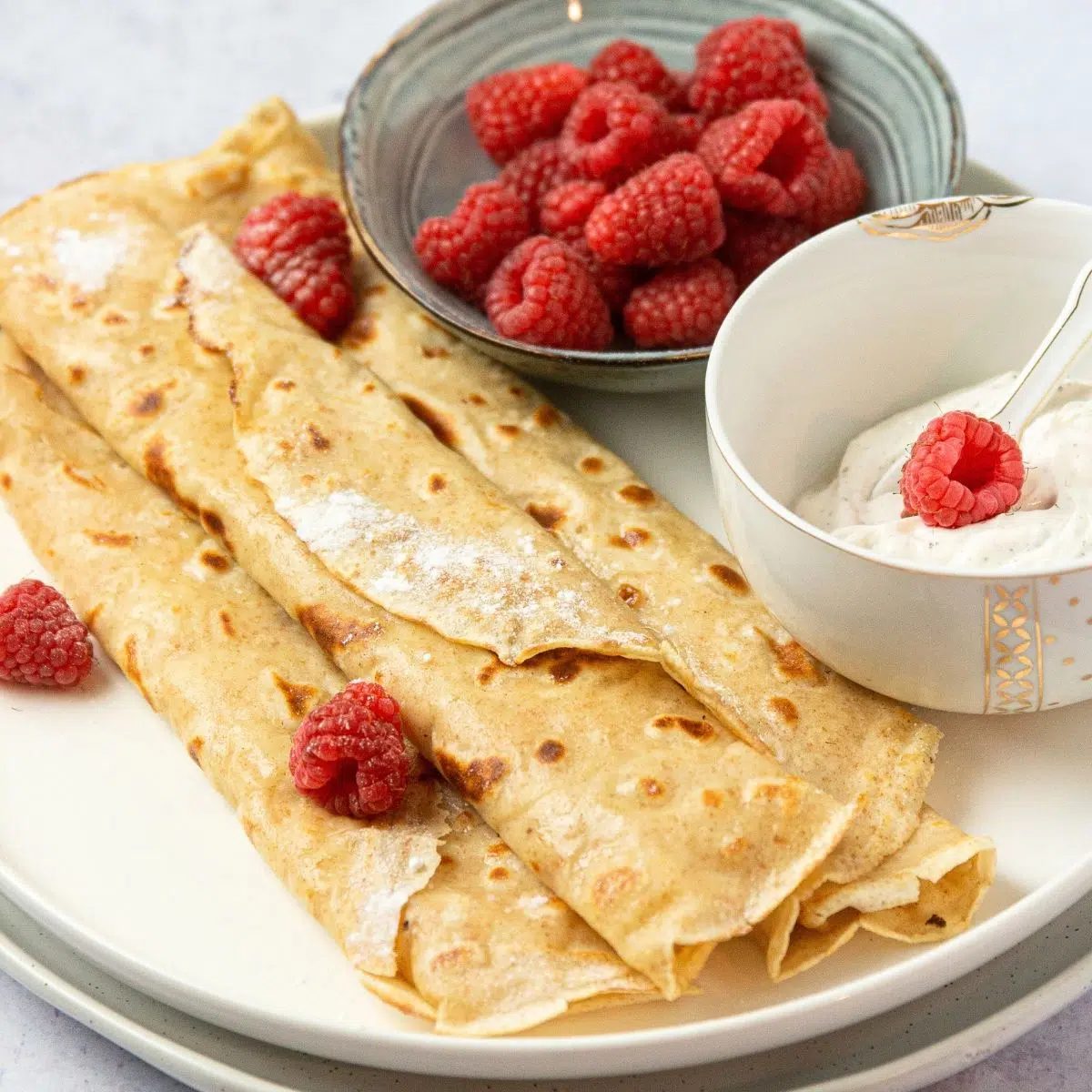 vegan crepes with berries and maple syrup