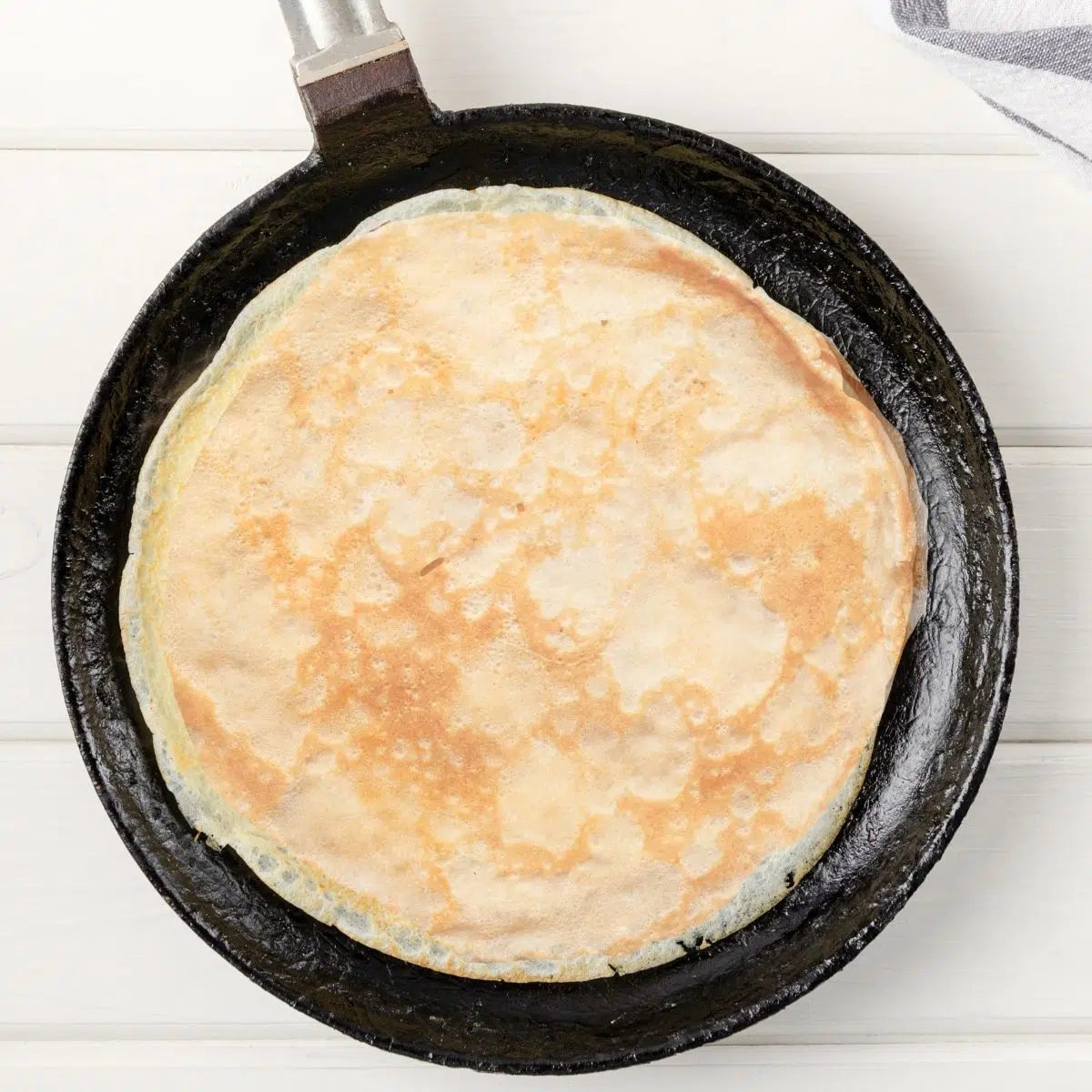 skillet with a crepe