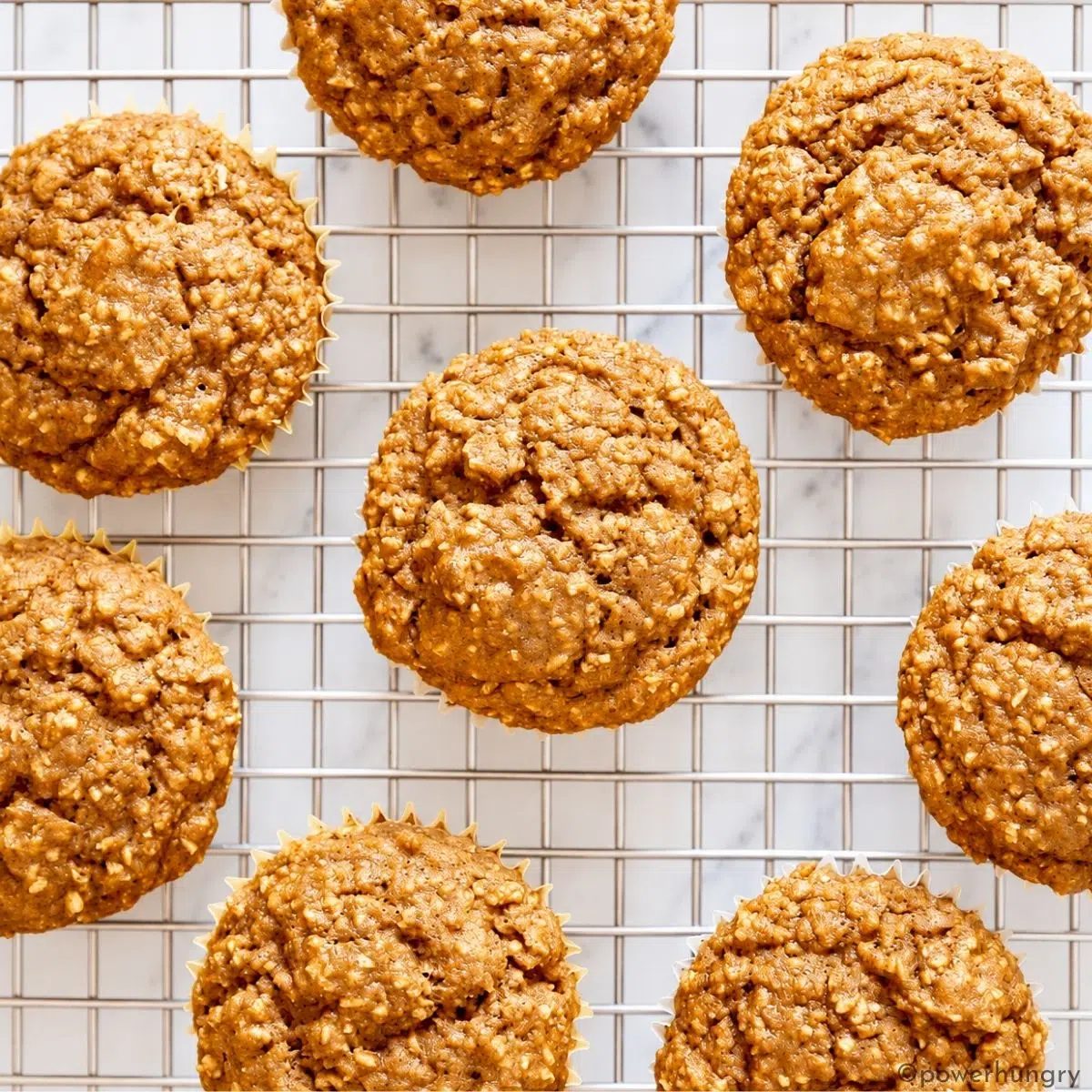 vegan oat bran muffins on a cooling rack