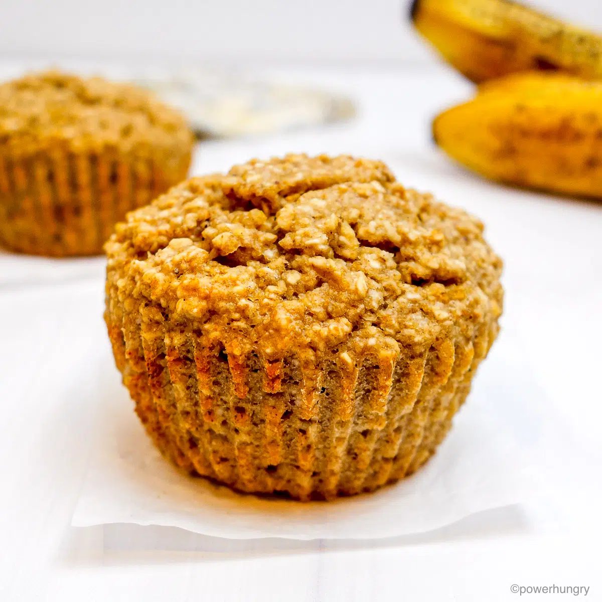 banana oat bran muffin on a white background