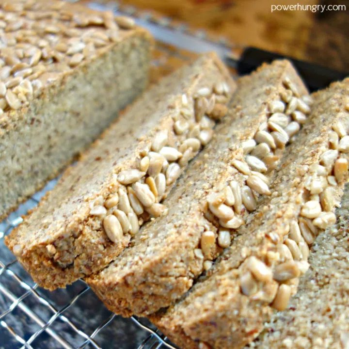 close up of sunflower seed bread on a wire cooling rack
