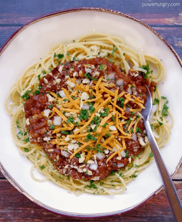 Overhead shot Lentil Cincinnati Chili in white bowl with brown trim