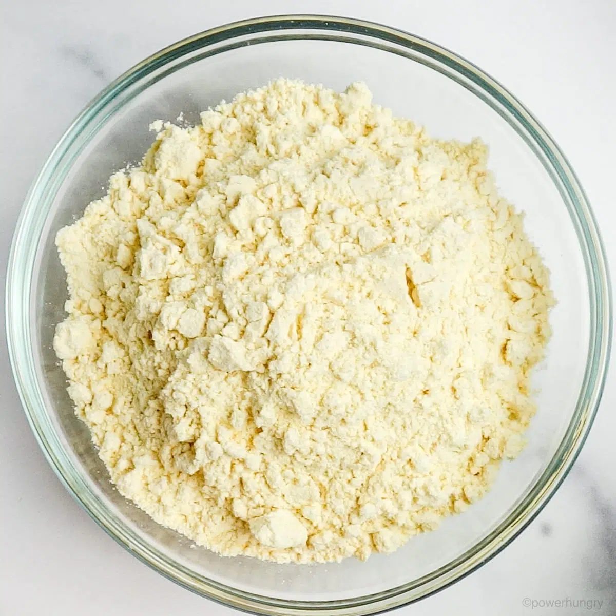 a glass bowl filled with chickpea flour