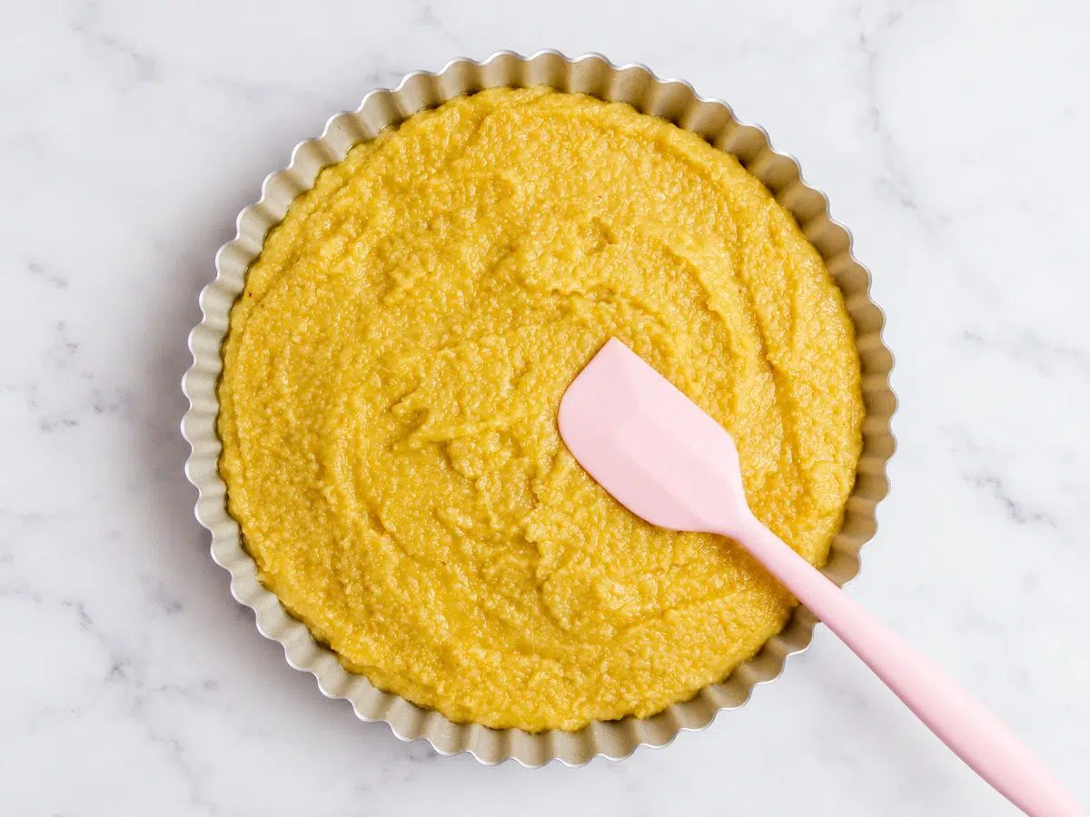 batter for crustless frangipane tart spread in tart pan