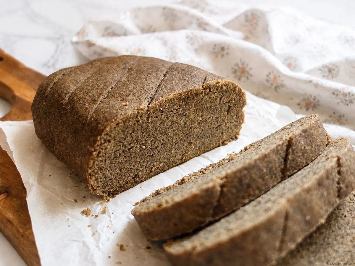 side view of the interior of vegan oat fiber bread on a cutting board