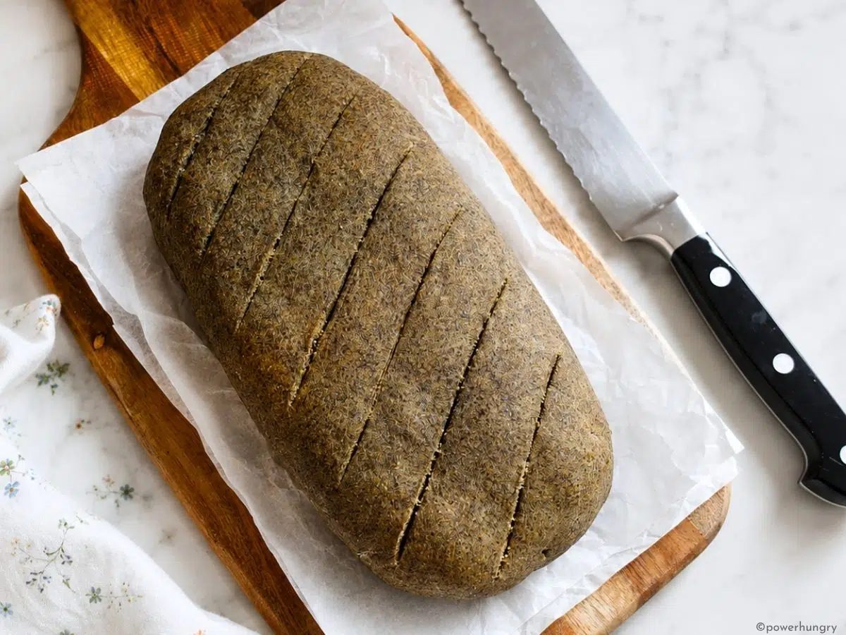 cooled vegan oat fiber bread on a cutting board