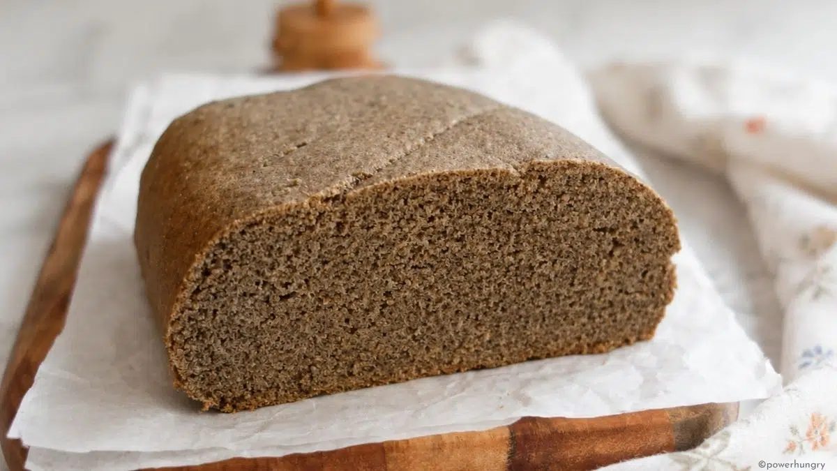 interior of a loaf of oat fiber bread, sitting on a cutting board