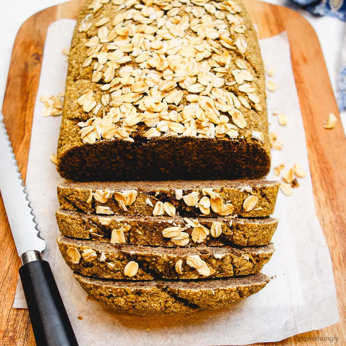 loaf of high protein oat bread on a cutting board