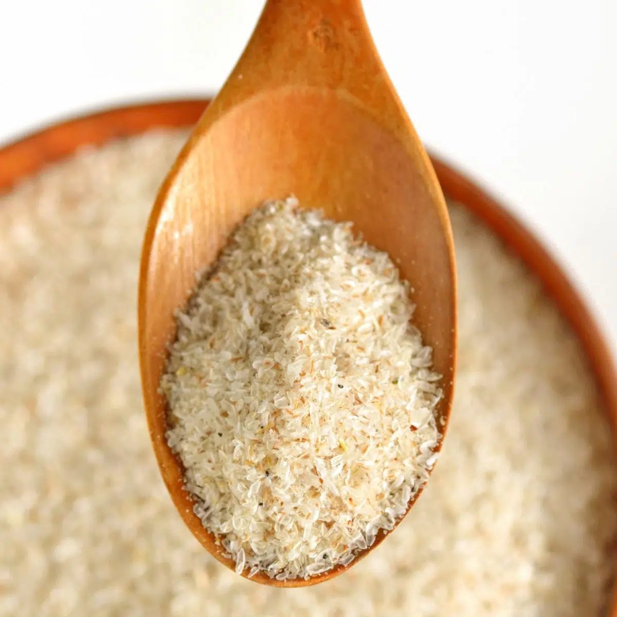 wooden spoon with psyllium husks in it