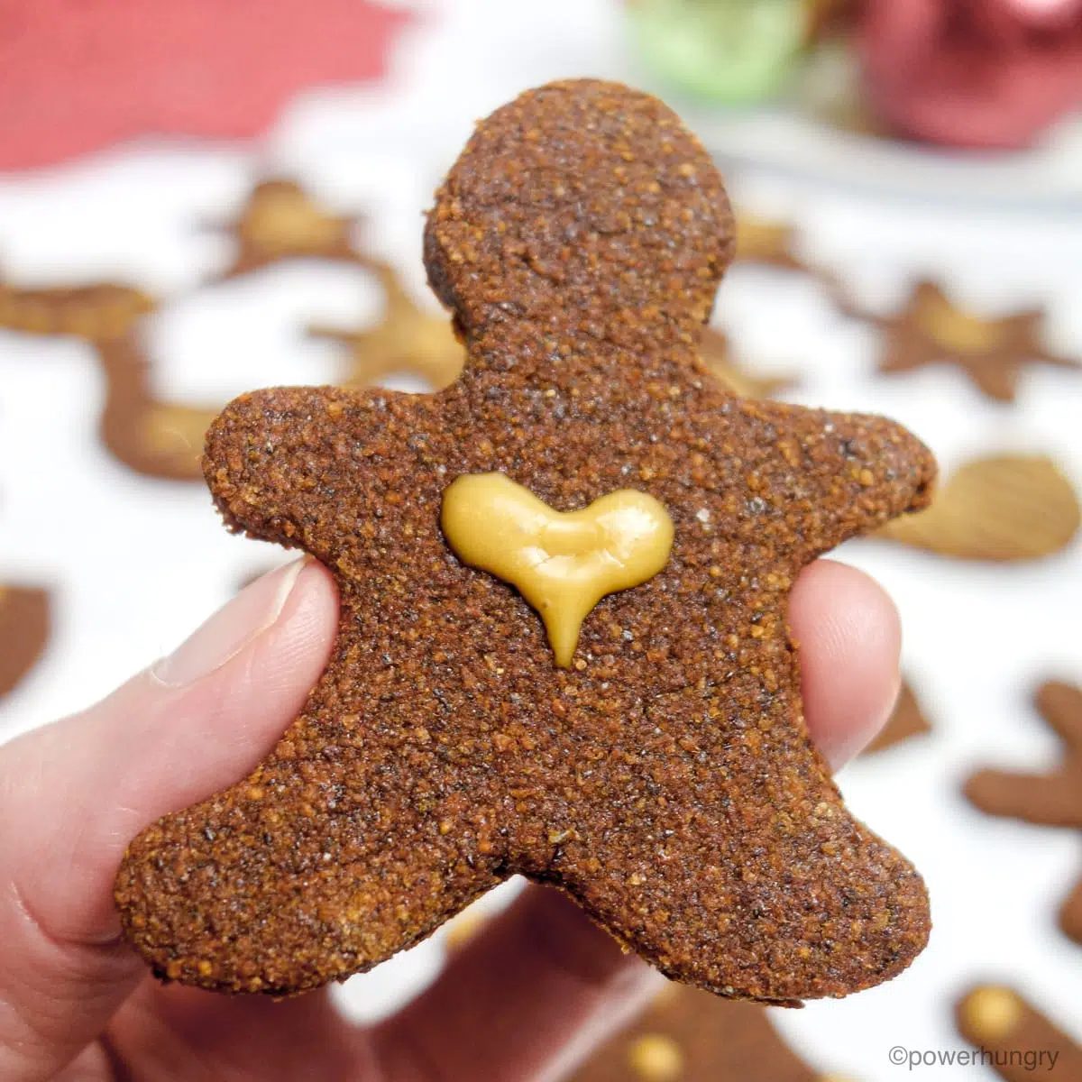 close up of a gingerbread cookie with heart icing