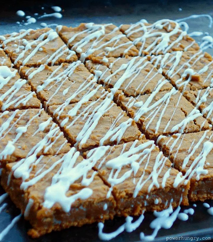 flourless gingerbread blondies drizzled with white chocolate