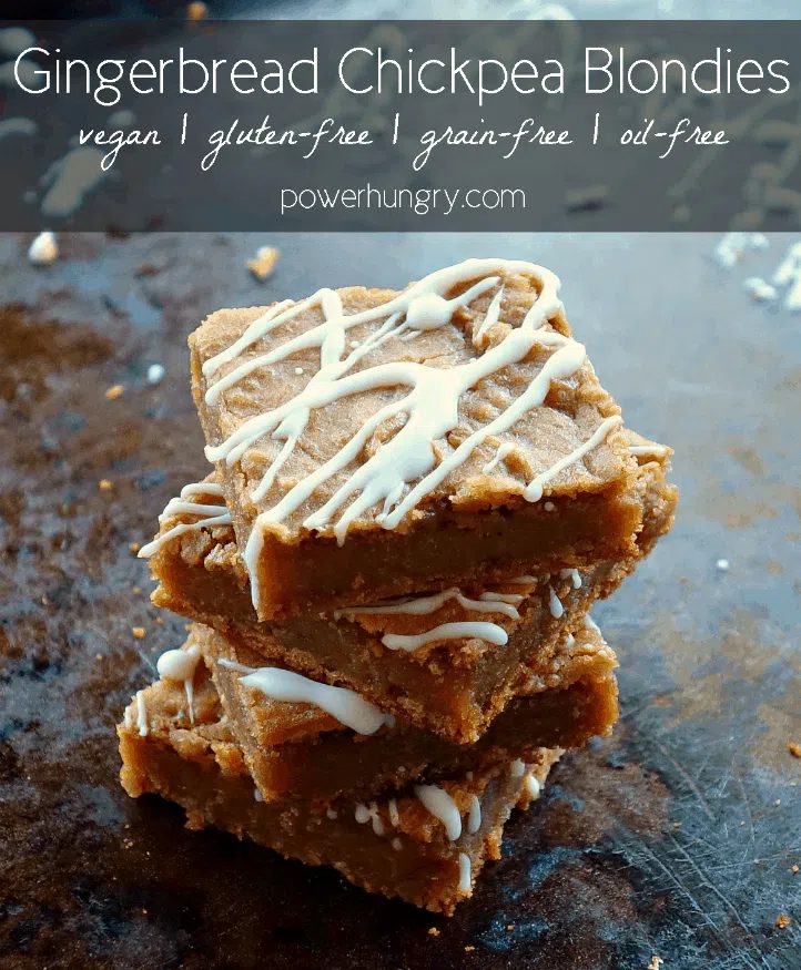 a stack of 4 gingerbread chickpea blondies, all drizzled with white chocolate