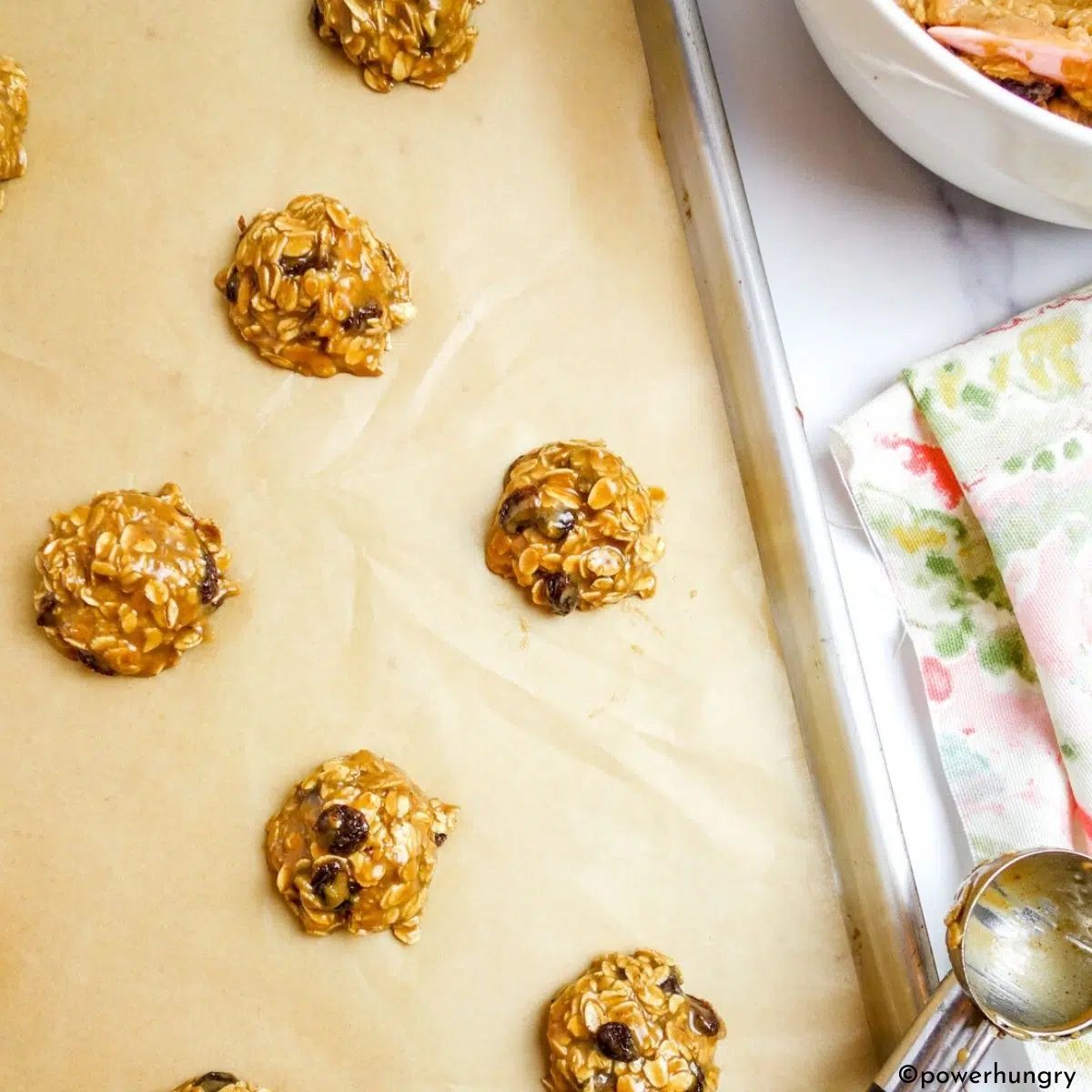 scooped cookie dough on a cookie sheet