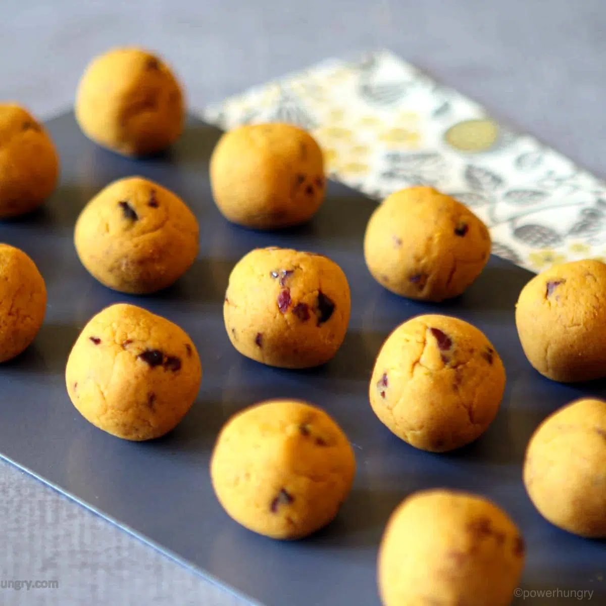 pumpkin protein balls on a slate board