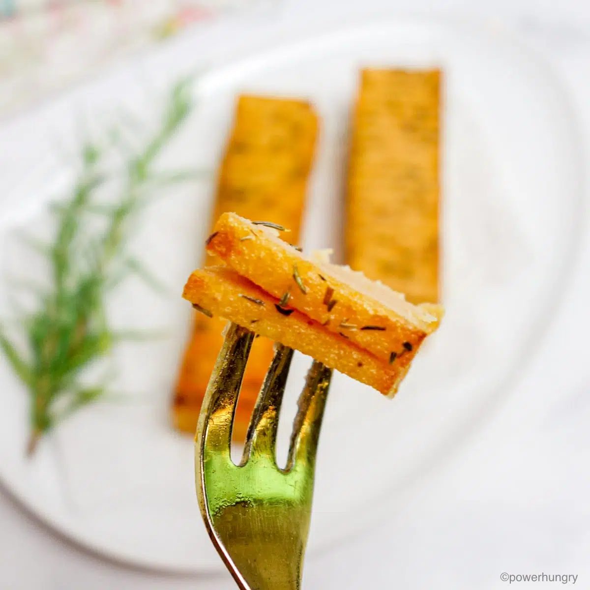 a forceful of vegan salmon on a golden fork