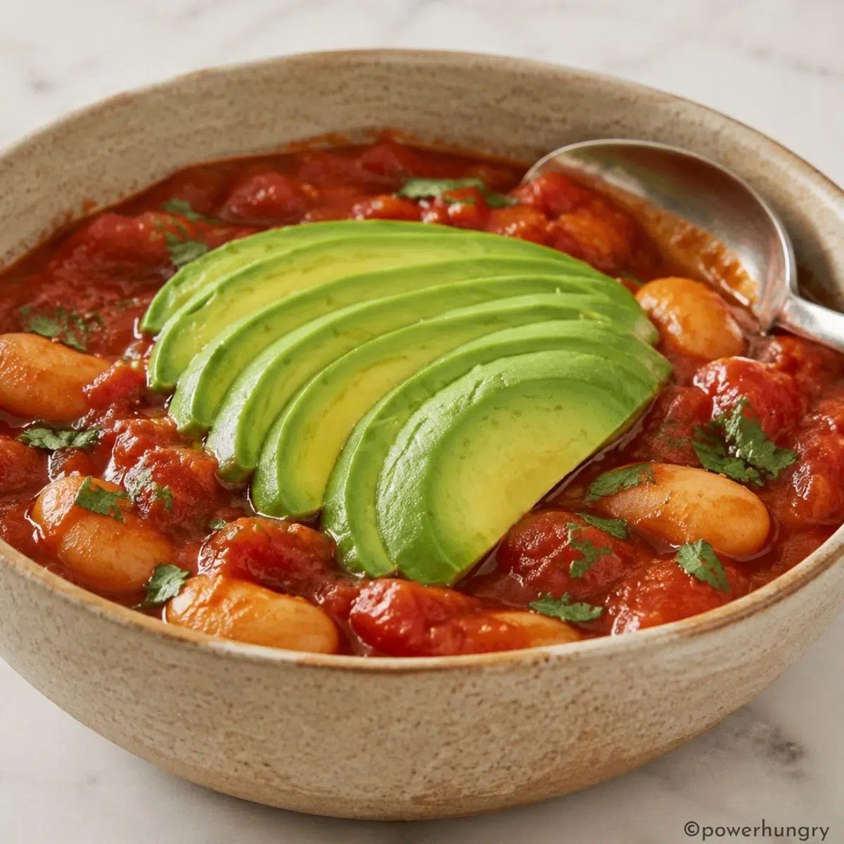 close-up of a bowl full of vegan shakshuka with butter beans