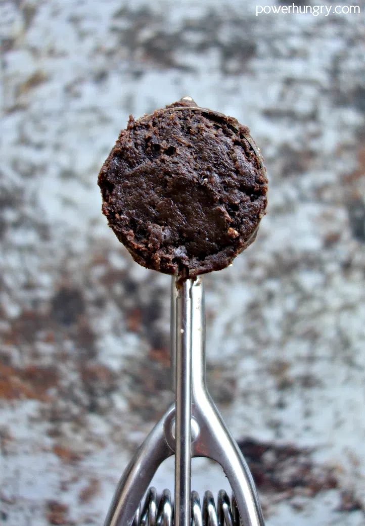 small cookie scoop filled with chocolate cookie dough
