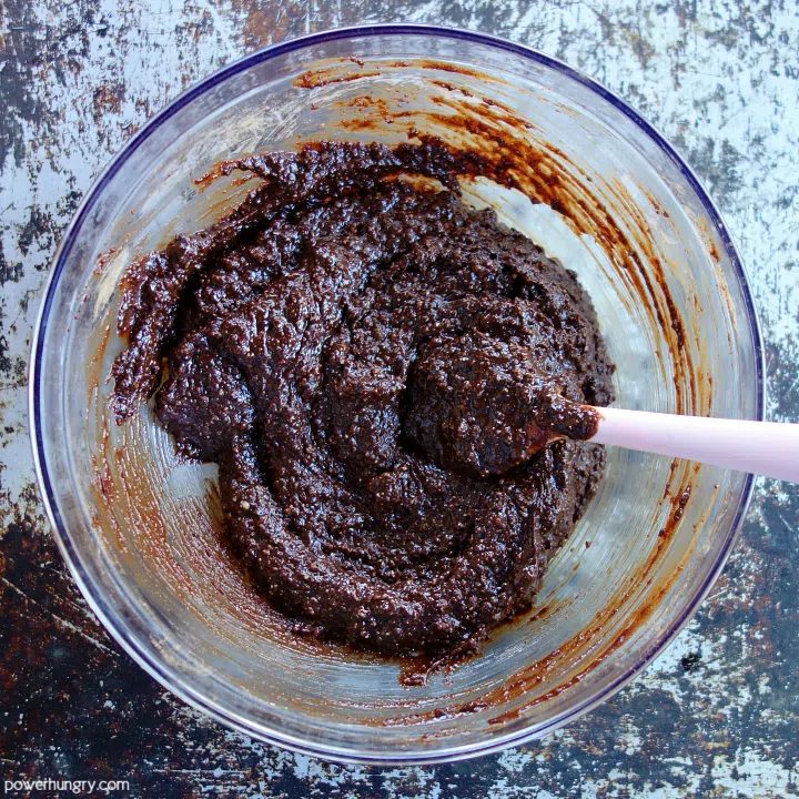 mixed cookie dough for vegan chocolate crinkles, in a glass bowl