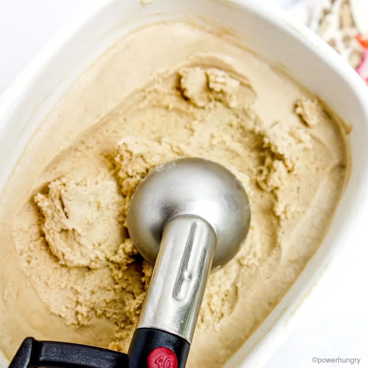 sunflower seed ice cream with a scoop in it