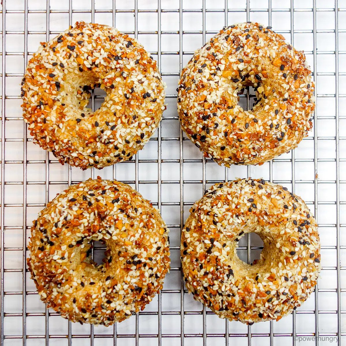 white bean bagels cooling on a cooling rack