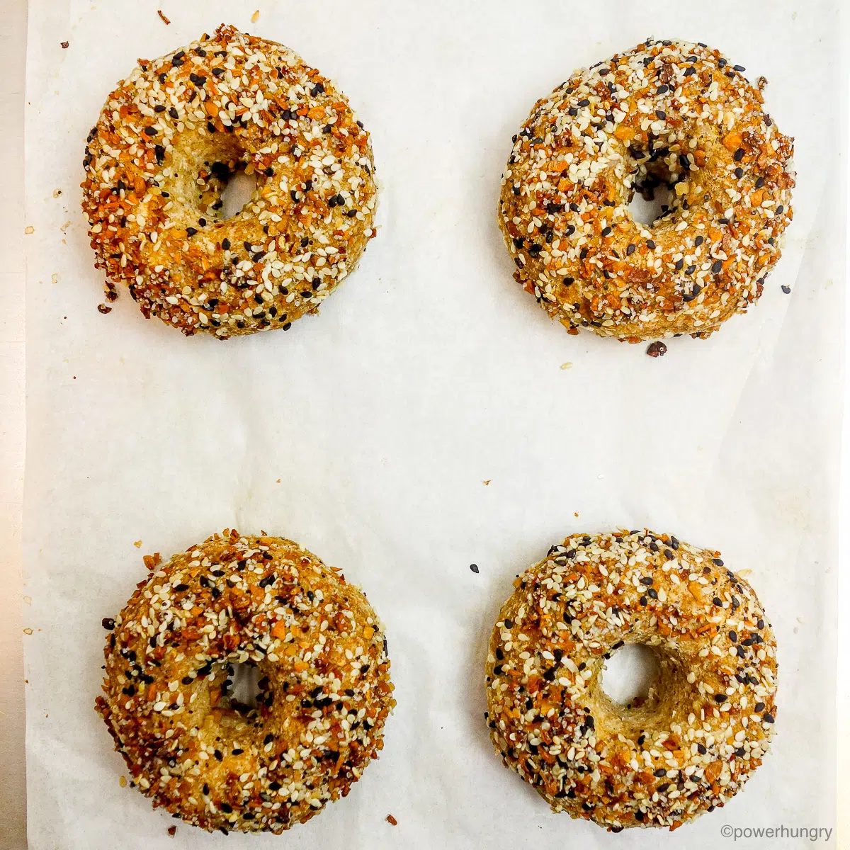 baked white bean bagels on a baking sheet