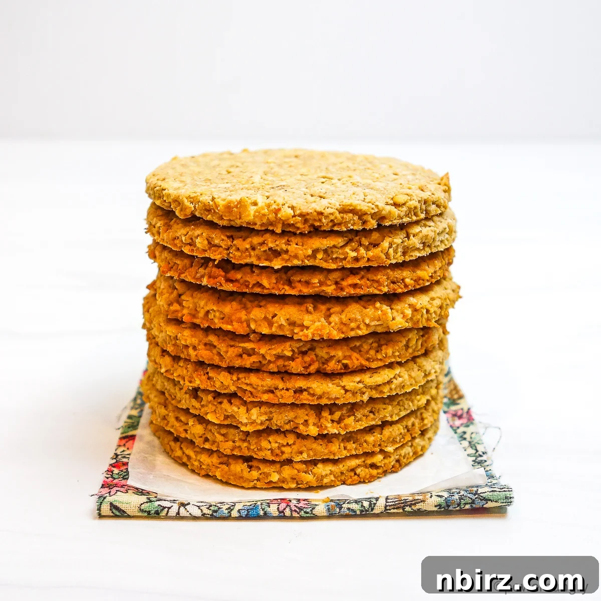 Wholesome Scottish Vegan Gluten Free Oatcakes 8 A perfectly stacked pile of freshly baked Scottish Oatcakes on a cooling rack, showcasing their golden brown edges