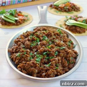 Finished vegan lentil taco meat in a serving bowl, ready for plating.