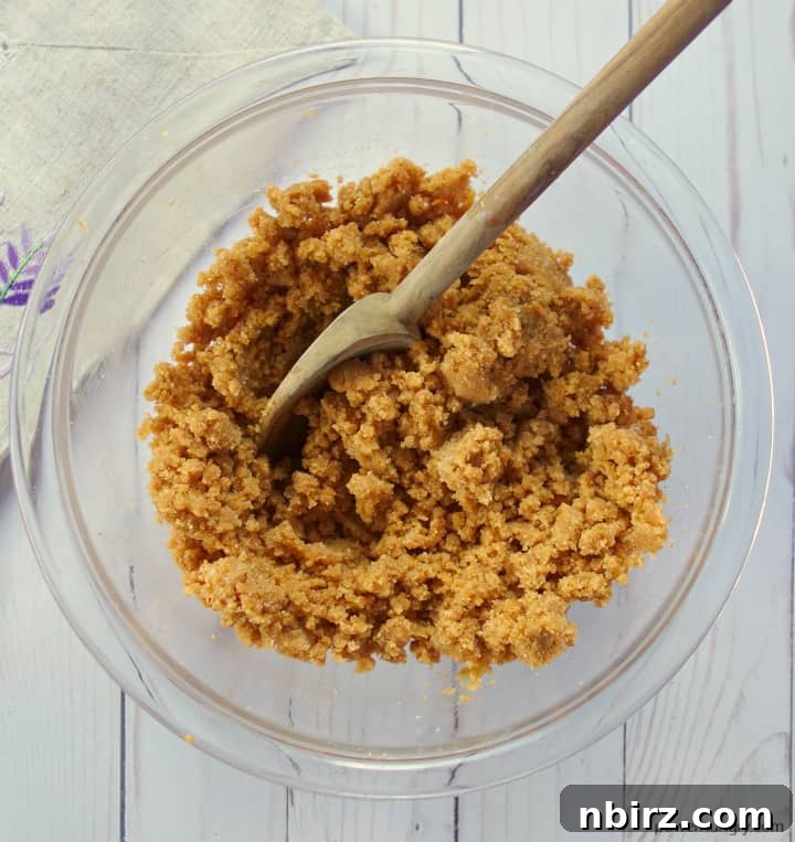 Wholesome Plant-Based Gluten-Free Pumpkin Almond Cookies 4 A glass bowl filled with the freshly mixed dough for vegan pumpkin almond cookies, ready for shaping.