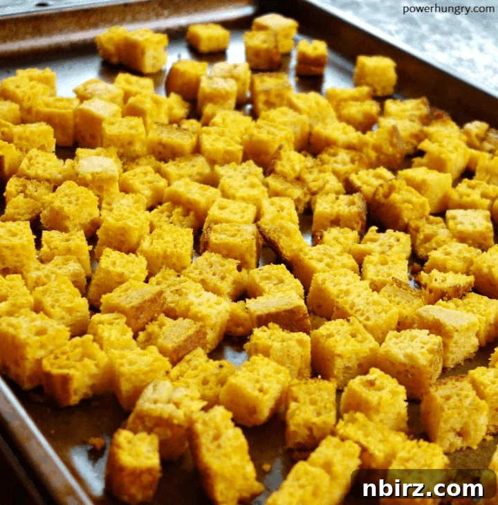 Vegan Cornbread Stuffing, Grain-Free and Guilt-Free 5 Toasted chickpea flour cornbread cubes on a baking sheet
