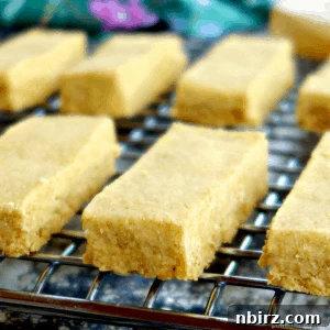 A perfectly baked chickpea flour shortbread cookie, showcasing its golden color and inviting texture.