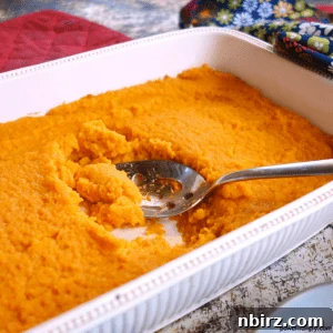A delightful close-up of the finished vegan carrot ginger soufflé, showcasing its perfectly baked texture and inviting golden hue.