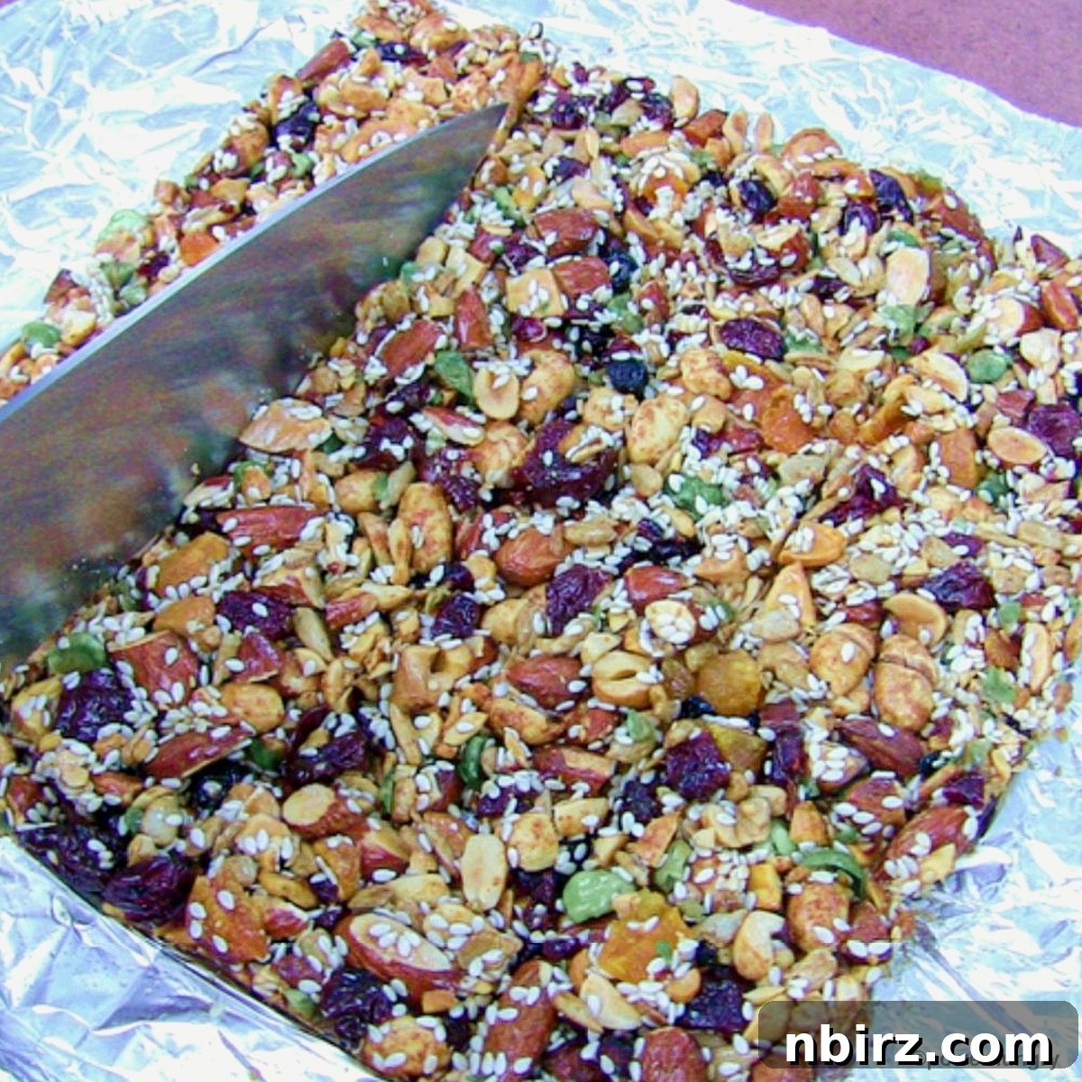 Homemade KIND Bars: A 4-Ingredient Delight 4 Cutting homemade KIND bars into individual servings