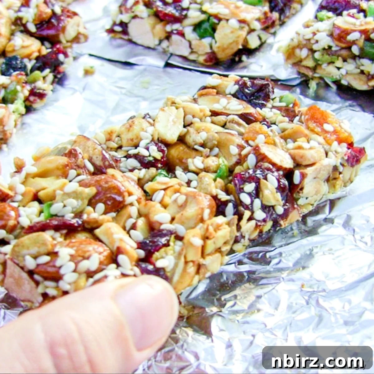 Homemade KIND Bars: A 4-Ingredient Delight 5 Removing a homemade KIND bar from the foil