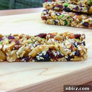 Homemade KIND Bars: A 4-Ingredient Delight 6 DIY kind bars on a wooden cutting board