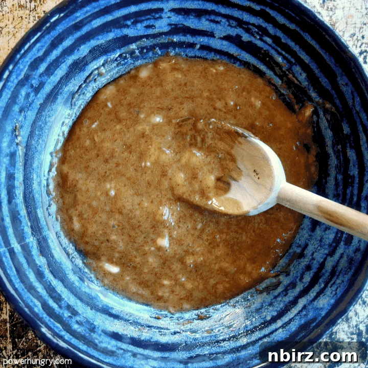 Wet ingredients for banana cookies in a bowl
