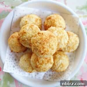 Irresistible Vegan Coconut Macaroons Gluten-Free and Oil-Free 3 a pile of vegan gluten-free macaroons on a white dish