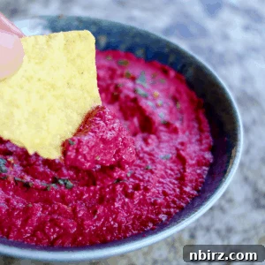Velvety Beet and Toasted Pepita Dip 11 Close-up of the vibrant Beet & Toasted Pepita Dip in a serving bowl, showcasing its rich texture and inviting presentation.