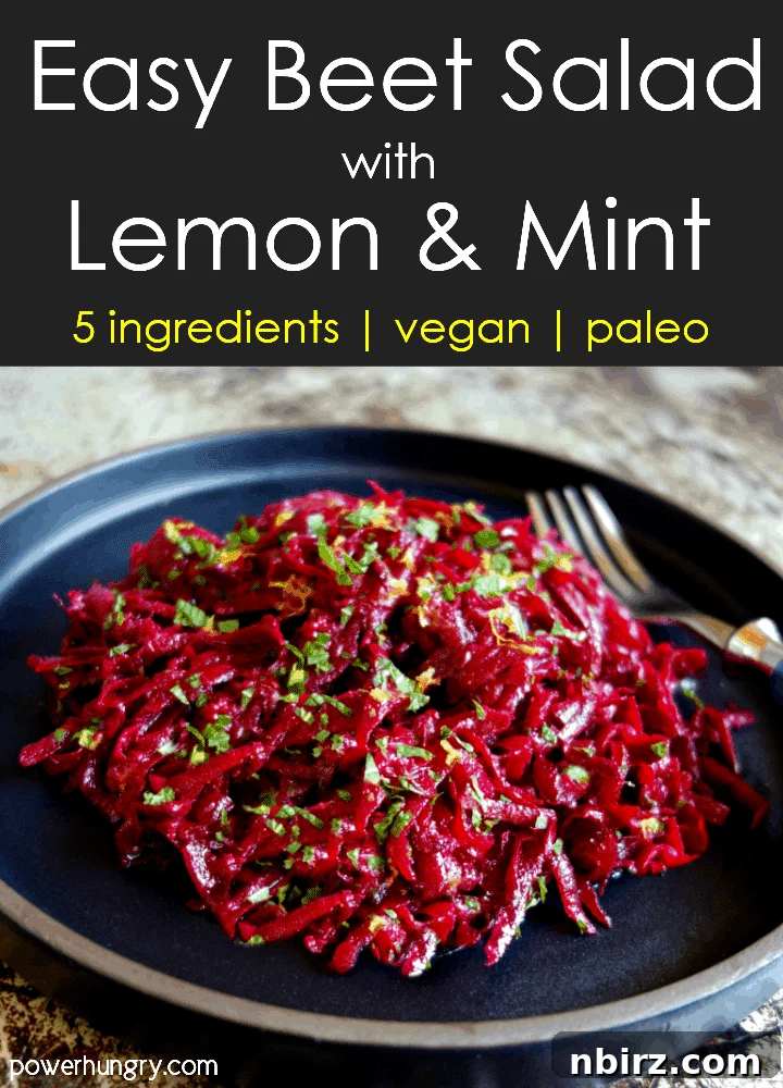 fresh beet salad with lemon & mint on a slate plate with a fork alongside