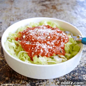 A bowl of steamed cabbage noodles, perfect for a vegan and keto diet, ready to be served.
