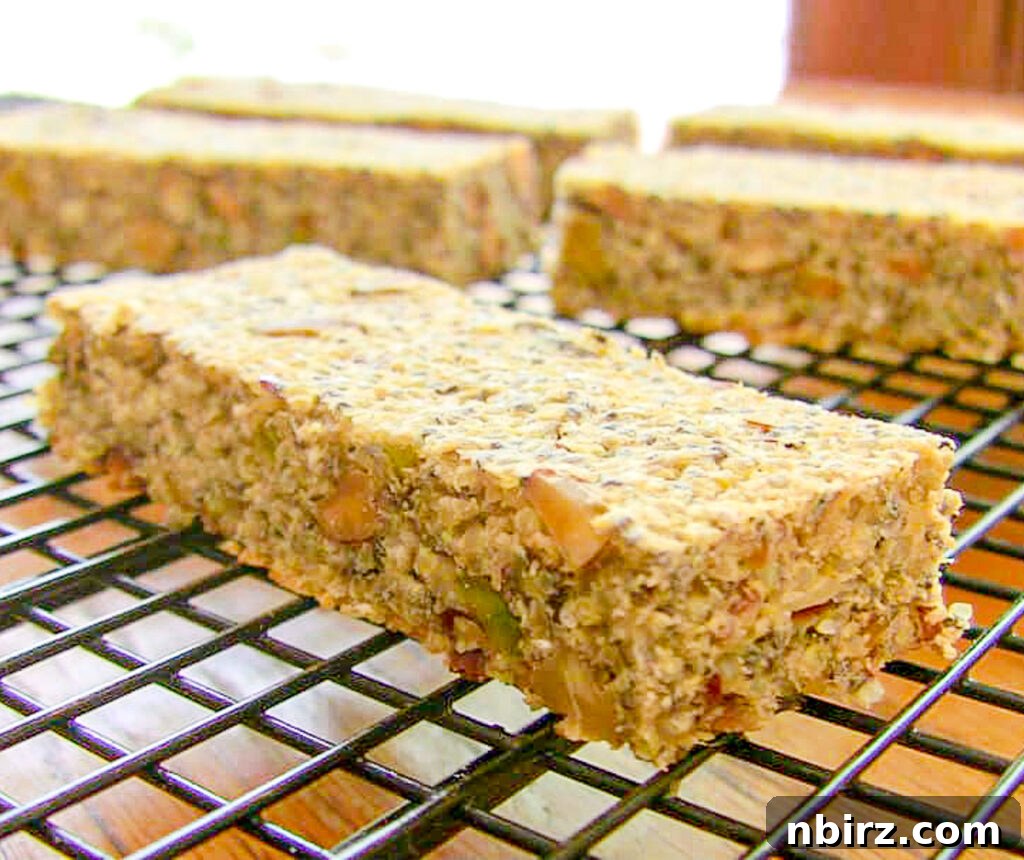 Guilt-Free Savory Vegan Energy Bars 3 Freshly baked homemade vegan savory power bars neatly cut and arranged on a black metal cooling rack.