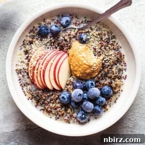 overhead shot of quinoa porridge in a white bowl