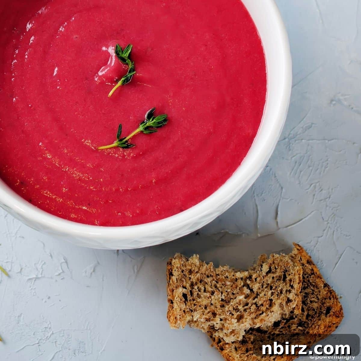 Quick & Creamy Beet Soup (Vegan & Gluten-Free) 3 Overhead Shot of Creamy Beet Soup in a White Bowl