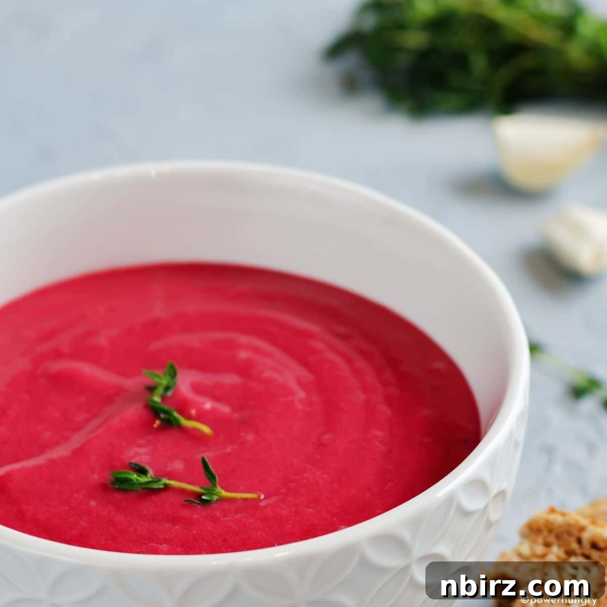 Quick & Creamy Beet Soup (Vegan & Gluten-Free) 4 Creamy Beet Soup in a White Bowl Topped with Herbs